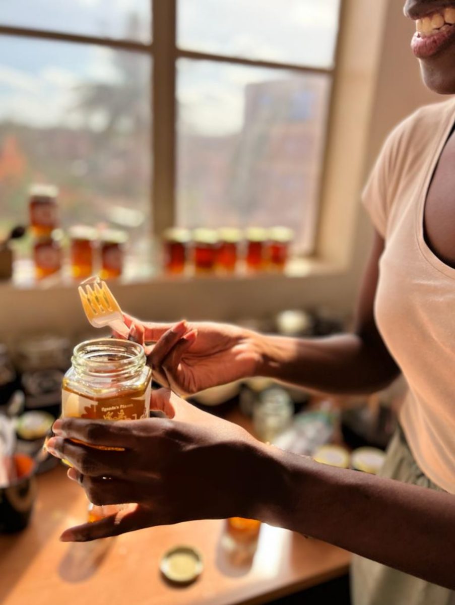 Pure raw Ugandan honey being poured after gentle cold extraction