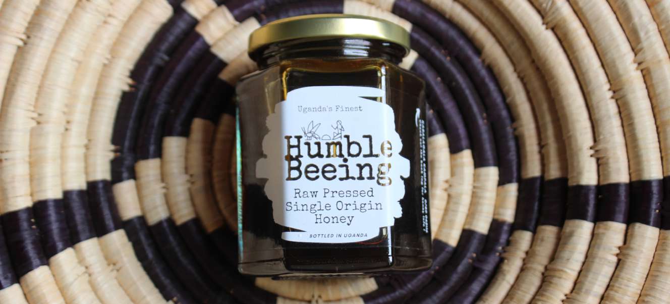 Jar of Humble Beeing raw pressed single-origin Nebbi multifloral honey, dark amber in colour